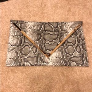 Grey snakesin clutch with gold chain
